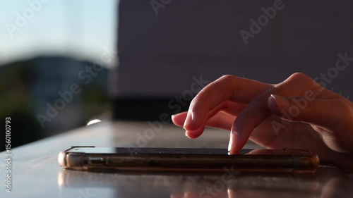 woman hand using smart mobile phone texting messages and online application