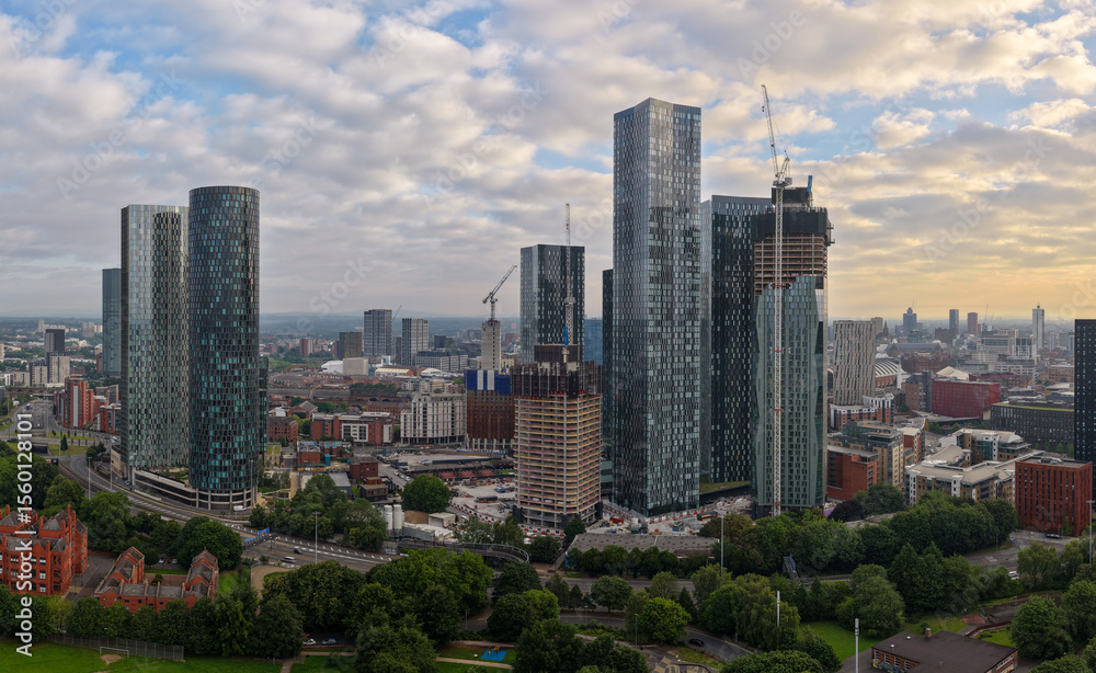Fototapeta premium Panoramic aerial image of Manchester skyline featuring New Jackson St high-rises and Mancunian way.