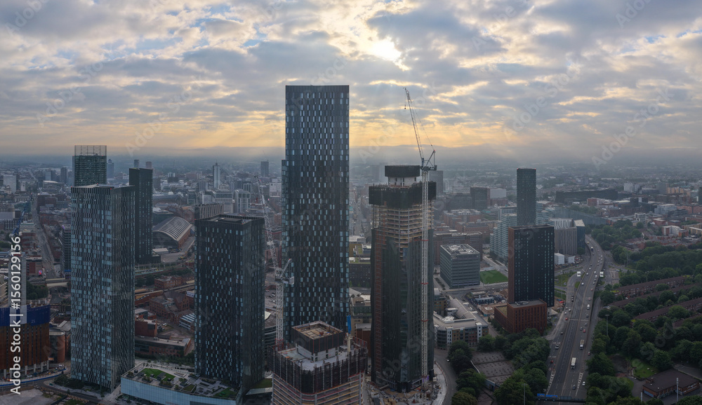 Obraz premium Panoramic aerial image of Manchester skyline featuring New Jackson St high-rises and Mancunian way. 