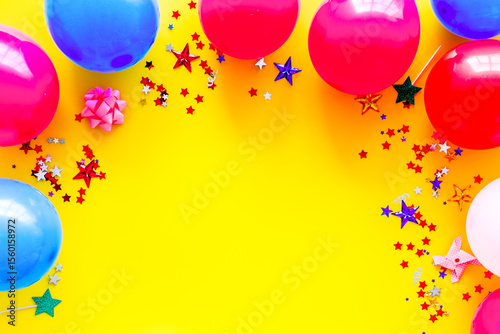Decorative frame with colorful balloons on yellow background top-down frame copy space