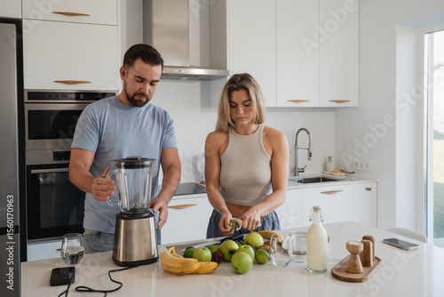 Photos Couple Preparing Healthy Smoothie Together in Bright Modern Kitchen