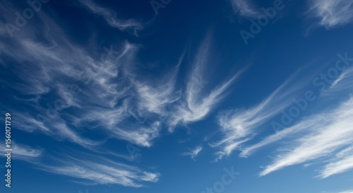 Stunning High-Resolution Image of Wispy Cirrus Clouds in a Vivid Blue Sky
