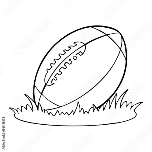 american football ball standing upright on grass field before kickoff