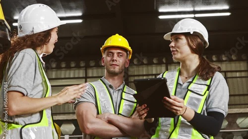 Group male and female robot engineers meet plan and inspect the work large robot site talk and understand offer ideas and listen their opinions so that the work can be completed as planned.

