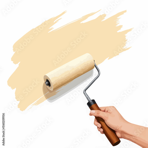 Hand holding paint roller applying beige paint on wall  