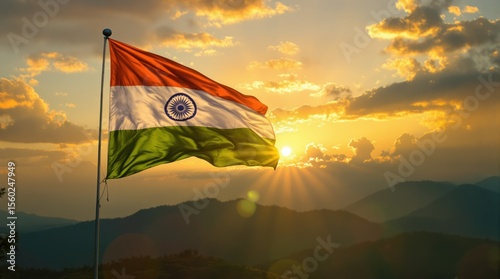 Indian flag waving at sunset in mountainous landscape