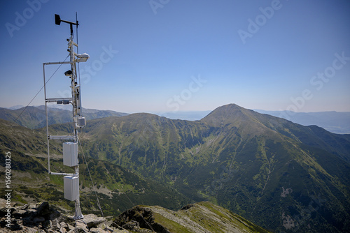 Automated weather station collecting meteorological data in a remote mountain area, contributing to climate research and weather forecasting