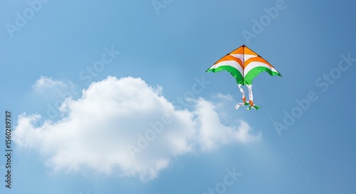 Tricolour Indian kite flying in blue sky with clouds symbolizing freedom and Independence Day celebration