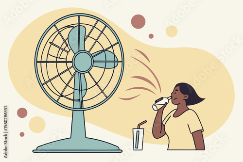 Woman drinking water in front of electric fan during hot weather heatwave