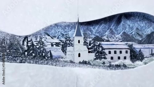 Paper-cut village covered in snow. Winter landscape with church and mountains in snowy setting  