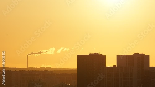 Dawn clouds over the metropolis of early winter sunset