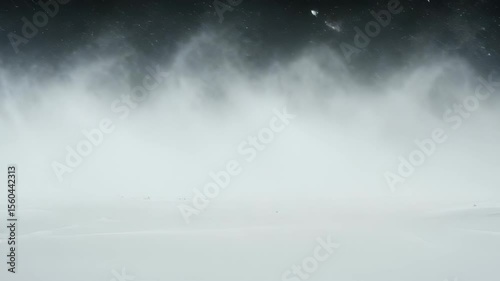 Abstract winter landscape featuring a snowstorm over a pristine field of white