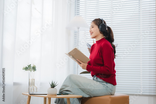 Harmony in Recording: A woman sits in a sun-drenched room, engrossed in recording, microphone in hand, her focus sharpened, embodying a serene state of concentration.