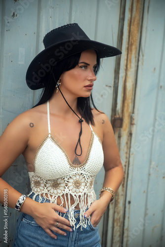 Young woman in cowboy hat outdoors