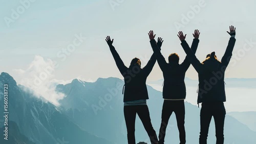 Together overcoming obstacles with three people holding hands up in the air on mountain top. We Made It. Celebrating success and achievements.	