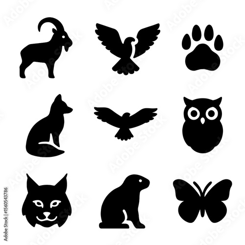 Mountain Wildlife Icons. Solid, filled icon set of mountain wildlife: mountain goat, eagle, bear print, fox silhouette, hawk in