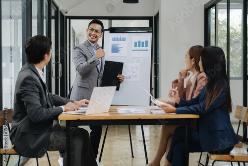 Meeting's Success: A business presentation unfolds as a group of professionals engages in a collaborative discussion, creating a dynamic and successful business strategy 