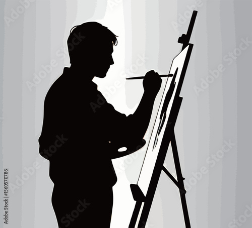 Silhouette of a male artist painting on an easel in a creative studio.