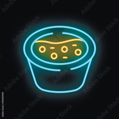 Neon sign showing a bowl of soup with croutons on a black background