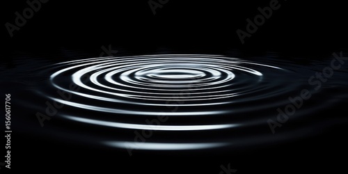 Concentric ripples on a dark surface