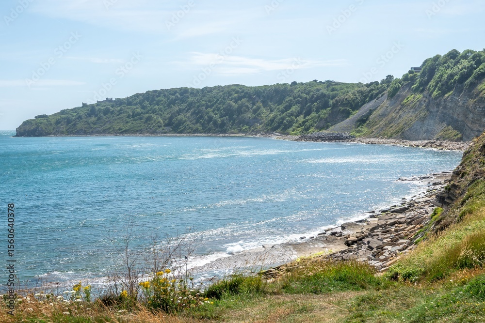 Obraz premium view of Durlston Castle and Durlston Country Park from The South West Coast Path at Swanage Dorset England