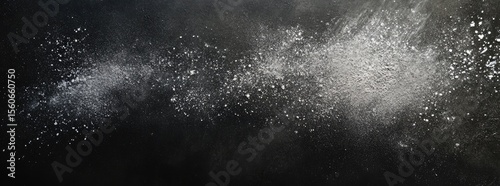 Abstract texture of light particles dispersed on a dark background