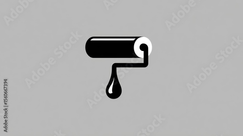 Black paint roller with a single black droplet on a solid gray background