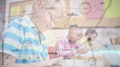 Schoolboy taking notes in education initiating network graphics fading in and classmates writing