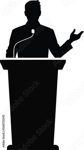 Silhouette of a confident speaker gesturing while standing behind a podium with a microphone