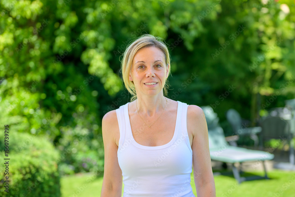Woman Standing Calmly In Garden Woman Standing Calmly In Garden
