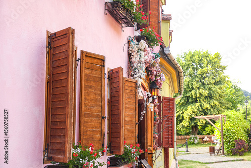 фотографія Medieval Street with Colorful Houses in Sighisoara, Romania – Historic Architect