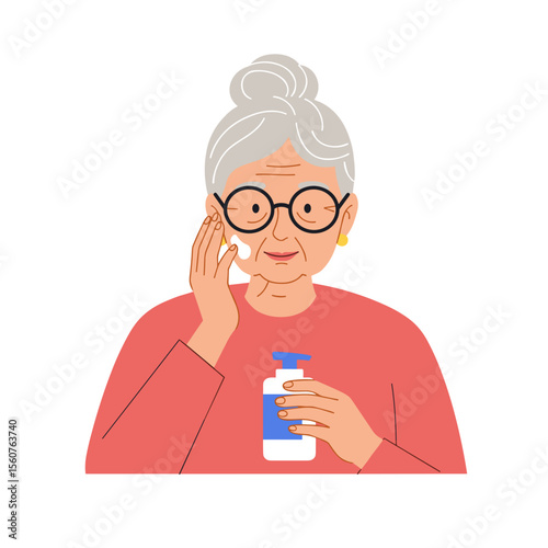 Elderly woman applying lotion to her face while holding a bottle  