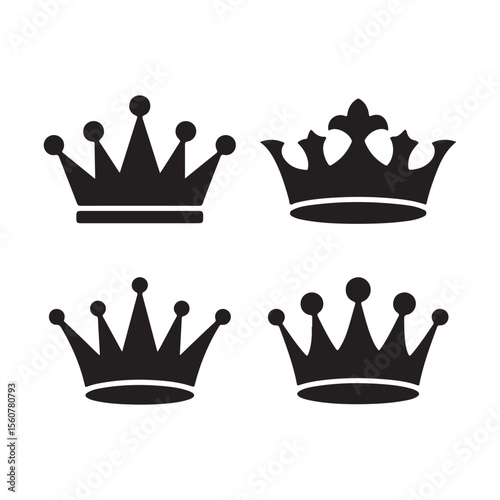 Four ornate black royal crowns displayed elegantly isolated on white background