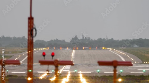 Close-up of airport runway with glowing landing lights, travel and transportation concept