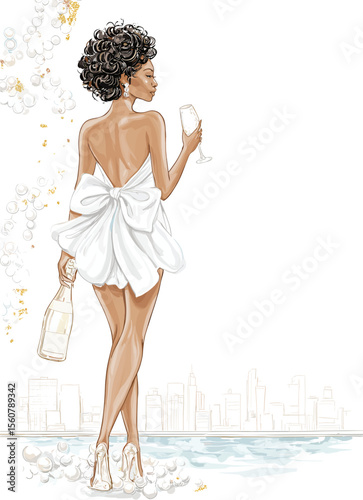 Young black woman celebrating with champagne on city waterfront  