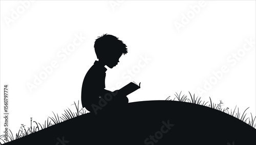 A silhouette of a boy reading a book