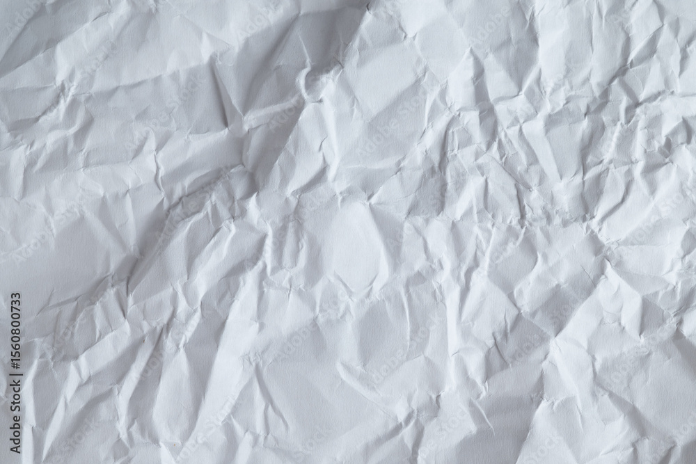 Fototapeta premium Wrinkled white sheet of paper background texture 