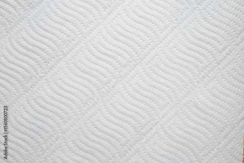Textured white paper towel surface with wavy pattern
