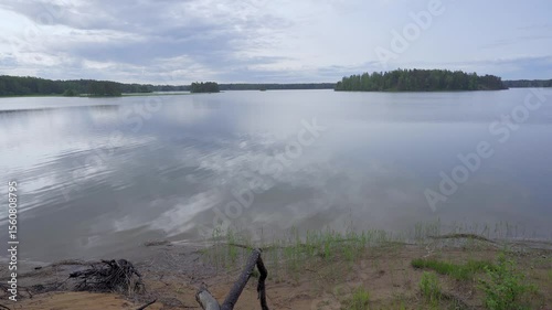 Experience the calming essence of spring in Porvoo, Finland. Peaceful sea water views, lush greenery, and gentle waves create a perfect nature escape. Enjoy the serenity of the landscape.	