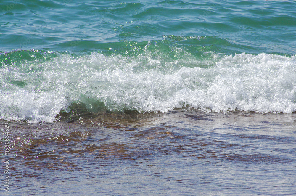 Fototapeta premium Wave of the sea on the sand beach