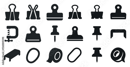 Collection of office supplies, including a stapler, paper clips, and a hole punch
