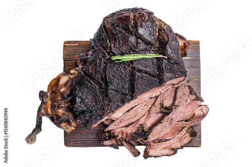 Slow ccoked sliced Venison leg, roasted game meat of deer on a board with herbs isolated on white background. top view