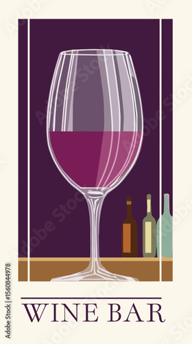 Elegant wine glass with red wine and bottles in background  