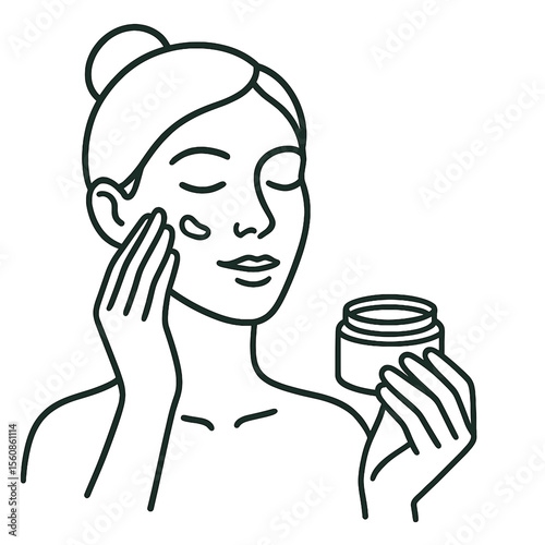 Young woman applying moisturizer to her face while holding jar  