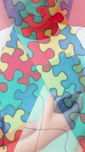 Jigsaw puzzle and ribbon icon against two diverse boys using smartphone at school