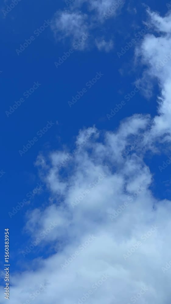 Billowing white clouds filling blue sky create dreamy atmosphere clip Billowing white clouds filling blue sky create dreamy atmosphere clip