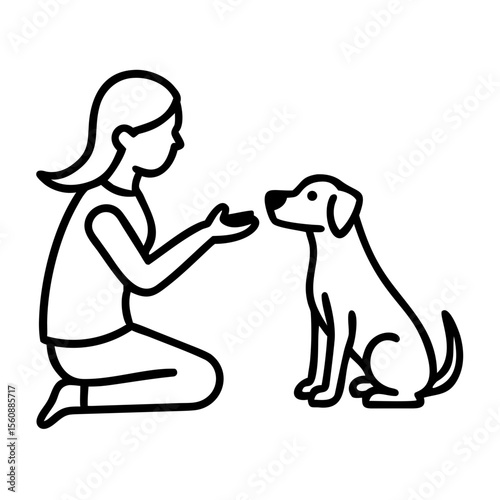 Woman giving treat to dog while kneeling on the floor indoors for International Dog Day  