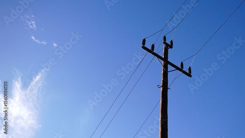 low voltage electric pole against the sky
