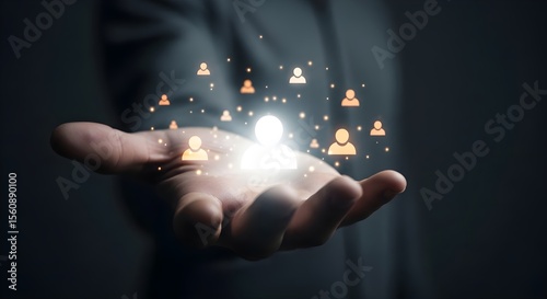 Person's hand holding glowing network.