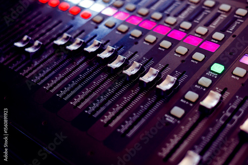 Concert sound mixer panel with volume regulators. Professional audio and light equipment for sound recording studio, live music broadcasting, television, party. mixing console. audio signals
